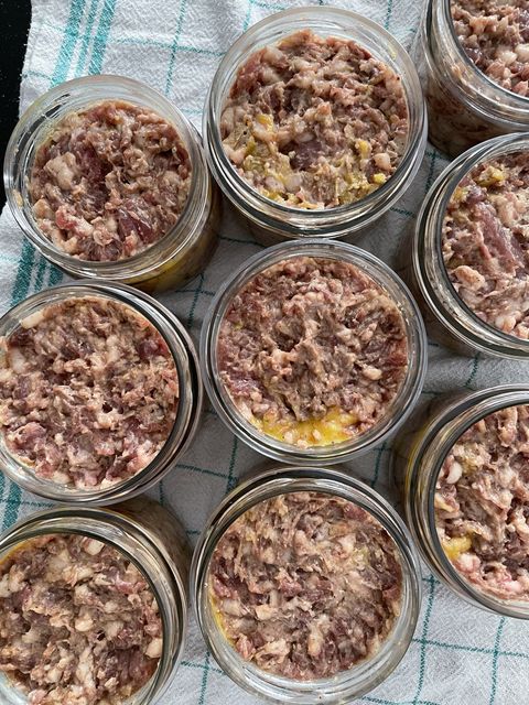 Jars filled with raw pâté before cooking