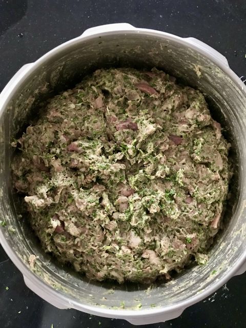 A herb-flecked mêlée in a stand-mixer bowl, bound and ready
