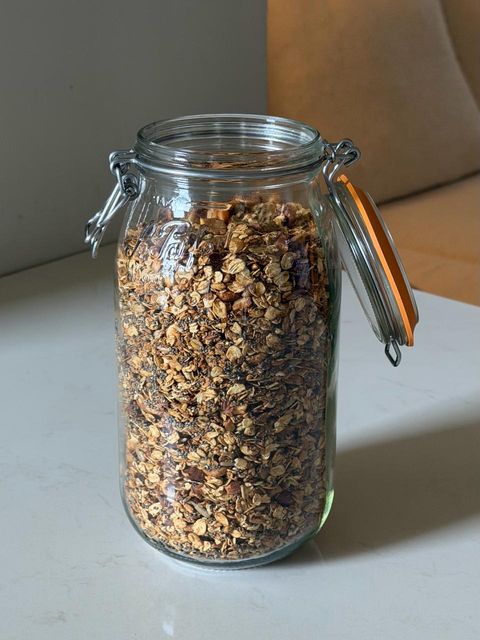 Jar of homemade granola with oats, nuts and seeds