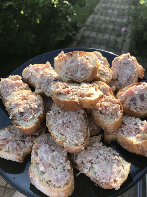 Slices of rabbit-hazelnut pâté on toasted baguette
